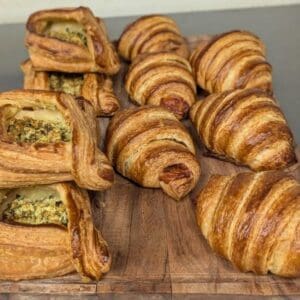 Assorted pastries on a wooden cutting board.
